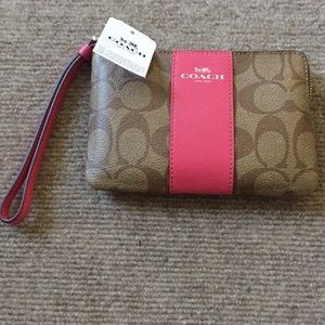 Pink and brown Coach wristlet